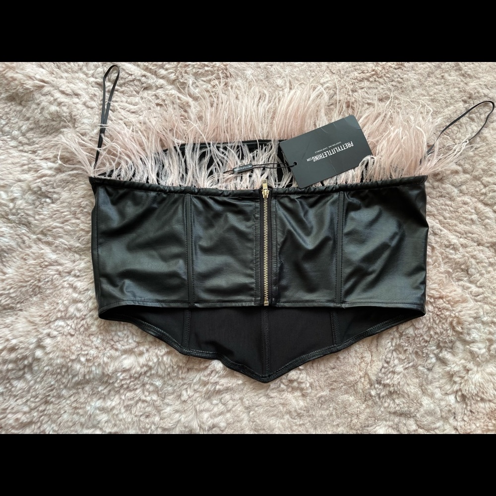 Brand new Pretty little thing. Corset crop top. Black with pink feathers.